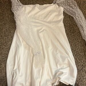 White dress with puff sleeves.